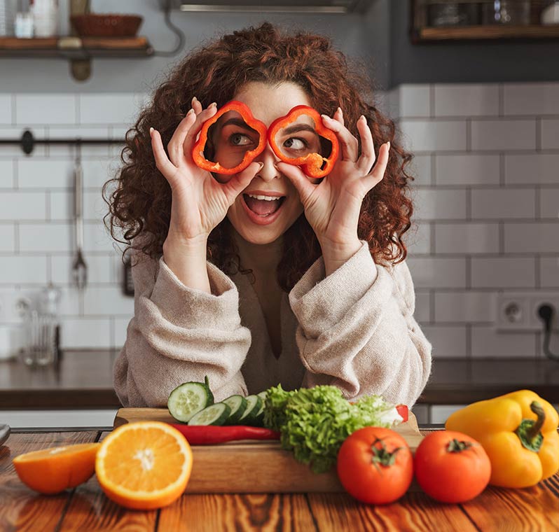 Woman holding Bell Pepper Circles in Front of Eyes Kesha Textile Woman Holding Bell Pepper Circles in Front of Eyes